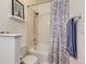 Cozy bathroom featuring a shower-tub combo and decorative shower curtain at 15700 E Jamison Dr # 7-203, Englewood, CO 80112