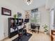 Carpeted exercise room with a workout machine and natural lighting at 15700 E Jamison Dr # 7-203, Englewood, CO 80112