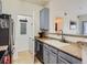 Updated kitchen featuring stainless steel appliances and stylish cabinets, next to laundry room at 15700 E Jamison Dr # 7-203, Englewood, CO 80112