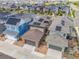 A high angle captures homes in the neighborhood with solar panels, showcasing their energy efficiency at 21482 E 60Th Ave, Aurora, CO 80019
