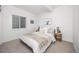 Bright bedroom with plush bedding, accent wall art, and side tables with lamps at 21482 E 60Th Ave, Aurora, CO 80019