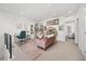 Versatile bonus room featuring a comfortable seating area, a home office, and stylish decor at 21482 E 60Th Ave, Aurora, CO 80019