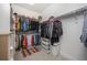 Walk-in closet with ample hanging space, shelving, and drawers for organized storage at 21482 E 60Th Ave, Aurora, CO 80019