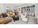 Bright and airy living room showcases a comfortable sofa, contemporary accents, and seamless indoor-outdoor flow at 21482 E 60Th Ave, Aurora, CO 80019