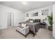 Serene main bedroom offers a cozy bed, stylish furnishings, and plenty of natural light at 21482 E 60Th Ave, Aurora, CO 80019
