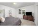Comfortable bedroom featuring soft carpet, modern decor, and ample natural light, creating a cozy retreat at 21482 E 60Th Ave, Aurora, CO 80019