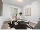 Cozy sitting area features modern decor, stylish chairs, and ample natural light, creating a relaxing space at 21482 E 60Th Ave, Aurora, CO 80019
