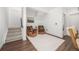 Cozy sitting room with hardwood floors, two armchairs, a small side table, and neutral-toned decor at 21482 E 60Th Ave, Aurora, CO 80019