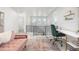 Bright landing area with modern railing, a cozy sofa, and ample natural light from large windows at 21482 E 60Th Ave, Aurora, CO 80019