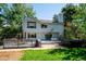 Back exterior features a deck area with hot tub at 2397 Hearth Dr, Evergreen, CO 80439