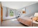 Bright bedroom with soft carpet, natural light, and simple decor at 2397 Hearth Dr, Evergreen, CO 80439