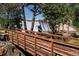Wooden bridge near the waterfall surrounded by trees in a scenic and serene environment at 2397 Hearth Dr, Evergreen, CO 80439