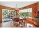 Warm dining area with access to a deck, perfect for enjoying outdoor meals at 2397 Hearth Dr, Evergreen, CO 80439