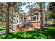 Two-story home featuring brick accents, and well maintained yard at 2397 Hearth Dr, Evergreen, CO 80439