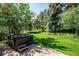 Backyard featuring a hot tub and well-maintained lawn at 2397 Hearth Dr, Evergreen, CO 80439