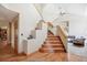 Elegant wooden staircase with a modern design and a view into the adjacent living area at 2397 Hearth Dr, Evergreen, CO 80439