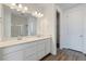 Modern bathroom features double vanity, large mirror, and a walk-in shower at 19100 E 96Th Pl, Commerce City, CO 80022