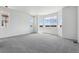 Bright bedroom featuring plush carpeting and multiple windows providing ample natural light at 19100 E 96Th Pl, Commerce City, CO 80022