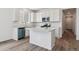 Modern kitchen featuring an island, stainless steel appliances, and ample counter space at 19100 E 96Th Pl, Commerce City, CO 80022