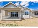 Rear exterior featuring a covered patio and an expansive outdoor space at 19100 E 96Th Pl, Commerce City, CO 80022