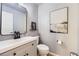Stylish half bath with a modern vanity, mirror, and fixtures at 3912 Ute Mountain Trl, Castle Rock, CO 80109