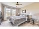 Bright bedroom featuring a ceiling fan, and a cozy bed with ample natural light at 3912 Ute Mountain Trl, Castle Rock, CO 80109