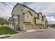 Townhome showcases a stone facade and attached garages, offering a blend of style and convenience at 3912 Ute Mountain Trl, Castle Rock, CO 80109