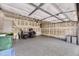 Spacious two-car garage featuring a speckled floor and neutral walls awaiting your personal touches and storage solutions at 3912 Ute Mountain Trl, Castle Rock, CO 80109