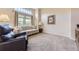 Bright living room boasts large window and neutral decor, perfect for comfortable living at 3912 Ute Mountain Trl, Castle Rock, CO 80109
