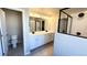 Bathroom featuring dual sinks, shower with glass door, and tiled flooring at 16830 Mckay Dr, Mead, CO 80542