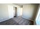 Well-lit bedroom offering plush carpet and double-door closet at 16830 Mckay Dr, Mead, CO 80542