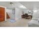 Finished basement area with stairs, a desk, and comfortable seating at 675 Dahlia St, Denver, CO 80220