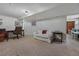 Finished basement area with a desk, comfortable seating, and decor at 675 Dahlia St, Denver, CO 80220