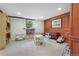A finished basement with a bookcase, toys and games, and a small table and chairs set at 675 Dahlia St, Denver, CO 80220