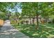 Charming home featuring a well-manicured lawn, stone walkway, and inviting front porch with an American flag at 675 Dahlia St, Denver, CO 80220