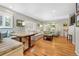 Bright living room featuring hardwood floors, large windows, and comfortable seating arrangements at 675 Dahlia St, Denver, CO 80220