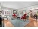 Spacious living room with hardwood floors, neutral walls, fireplace, and bright, natural light at 675 Dahlia St, Denver, CO 80220