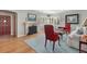 Inviting living room with hardwood floors, fireplace, and plantation shutters offering cozy elegance at 675 Dahlia St, Denver, CO 80220