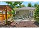 Patio with dining table, chairs, pergola, bench and fire pit at 675 Dahlia St, Denver, CO 80220