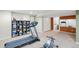 Finished basement offers gym equipment, and games, with an adjacent bathroom at 5910 W Sumac Ave, Littleton, CO 80123