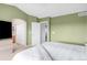 Bedroom with a closet and doorway, and a television set upon a bureau at 5910 W Sumac Ave, Littleton, CO 80123
