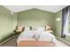 Bedroom with vaulted ceilings, gray curtains, and a large bed with neutral decor at 5910 W Sumac Ave, Littleton, CO 80123