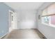 Bedroom features neutral tones, carpet flooring, closet and a bright window at 5910 W Sumac Ave, Littleton, CO 80123
