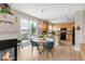 Charming dining area with a round table and backyard views, connected to the kitchen at 5910 W Sumac Ave, Littleton, CO 80123
