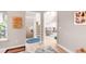 Inviting entryway showcasing hardwood floors leading to a staircase and the living area at 5910 W Sumac Ave, Littleton, CO 80123