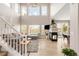 Bright and airy living room with a fireplace, hardwood floors, large windows, and comfortable seating at 5910 W Sumac Ave, Littleton, CO 80123