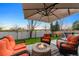 Cozy backyard patio featuring comfortable seating around a fire pit, ideal for outdoor entertaining and relaxation at 5910 W Sumac Ave, Littleton, CO 80123