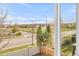 Picture window shows a neighborhood with a school and sports field at 5910 W Sumac Ave, Littleton, CO 80123