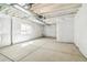 Unfinished basement featuring a window, concrete floors, and white plastic-covered walls at 4371 Soapberry Pl, Castle Rock, CO 80108