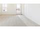 Bright bedroom features carpet, white trim and a door to the patio at 4371 Soapberry Pl, Castle Rock, CO 80108
